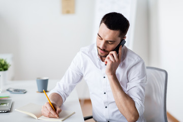 Wall Mural - businessman calling on smartphone at office