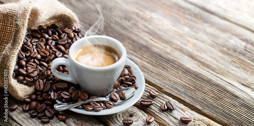 Fototapeta na wymiar Espresso Coffee Cup With Beans On Vintage Table
