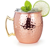 Moscow Mule Cocktail In A Copper Mug Garnished With Lime And Mint Leaves