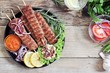 © losangela - Kebab of minced beef or lamb with vegetables and herbs. Traditional meat kebab on rustic dinner table .