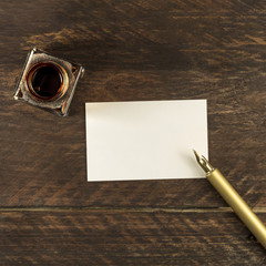 Wall Mural - Blank white business card with ink pen and bottle