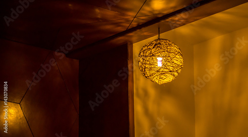 Illuminated Round Ceiling Light In The Corner Of A Room