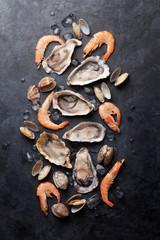 Wall Mural - Fresh seafood on stone table