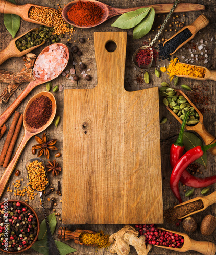 Photo Background with different spices around the cutting board