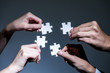 hands holding pieces of jigsaw puzzle, business to business, business matching concept