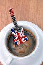 Guitar Souvenir From London In Espresso Cup On Wood Background
