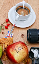 White Cup Of Espresso, Souvenir Guitar From London, Camera Lens, Rose Hips And Apple With Text Love