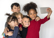 © Rawpixel.com - Group Children Taking Photo Happiness Adorable