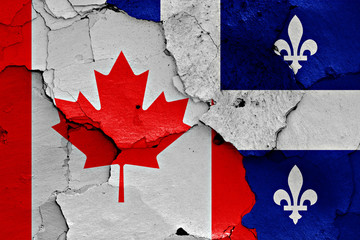 Wall Mural - flags of Canada and Quebec painted on cracked wall