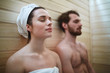 © pressmaster - Pleased woman enjoying time in sauna with her husband