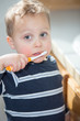 © hmphoto06 - Toddler boy brushing teeth.