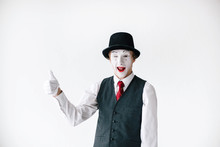 Funny Mime In Black Hat Holds His Thumb Up