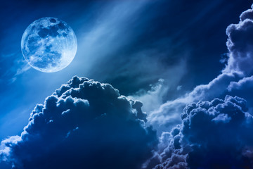 Wall Mural - Nighttime sky with clouds and bright full moon with shiny.