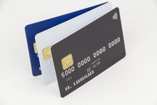 Three Credit Card (black, White And Blue) As Template For Your Design With Shallow Depth Of Field On White Background