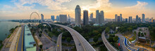 Aerial View Of Singapore City Skyline On High Way In Sunrise Or Sunset At Marina Bay, Singapore