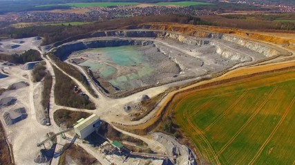 Wall Mural -   Camera flight over a open cast mine. Industrial landscape. Heavy industry from above. 

