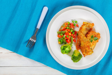 Sticker - deep fried perch fillets and mix of vegetables