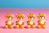 Fototapeta Pokój dzieciecy - Quatre bonbons en pâte de fruit représentant des petits tigres