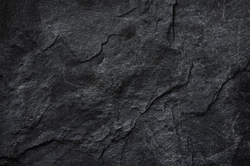 dark grey black slate background or texture.