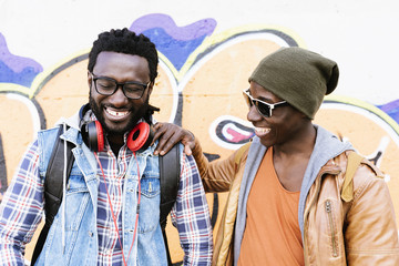 Two black race friends having fun in the park.