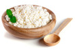 Cottage cheese in a wooden bowl isolated on a white background