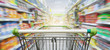 © nonnie192 - Supermarket aisle with empty green shopping cart