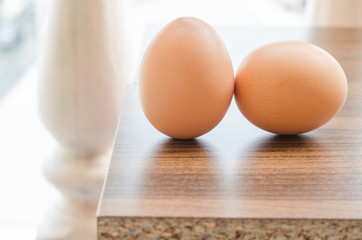 two egg on wood table.