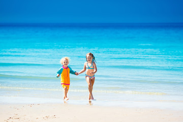 Wall Mural - Kids run and play on tropical beach