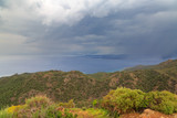 Fototapeta Sawanna - Rain clouds with distance in Datca mountains