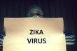 © catalin - Doctor Holding Zika Virus Sign