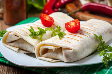 Canvas Print - Burritos filled wiht minced meat, bean and vegetables.