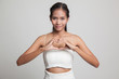 © halfbottle - Young Asian woman show heart hand sign.
