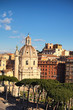 View to rooftops of Rome skyline with domes church Santa Maria di Loreto and dome church Nome di María , across from the Trajan's Column, near the Monument of Vittorio Emanuele at Piazza Venezia