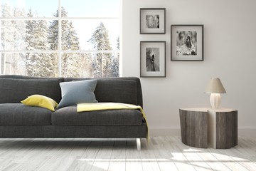 White room with sofa and winter landscape in window. Scandinavian interior design. 3D illustration