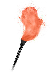 Make up brush with cosmetic powder splash isolated on white background