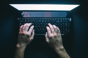 russian hacker hacking the server in the dark