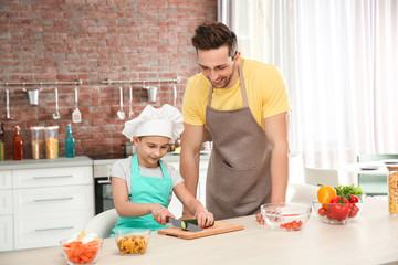 Wall Mural - Dad and son cooking at home