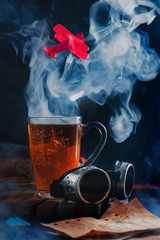 Wall Mural - Cloud of steam rising from a coffee cup with a flying red airplane