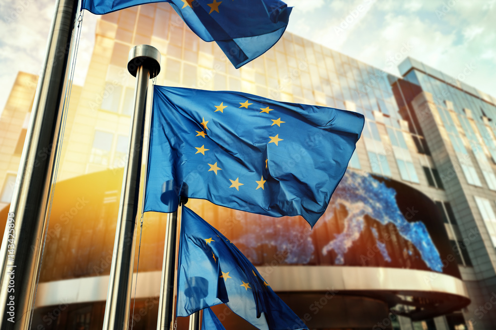 Obraz na płótnie EU flags waving in front of European Parliament building. Brussels, Belgium w salonie
