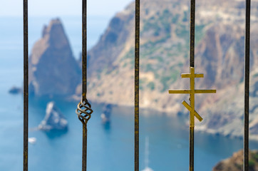 Forged elements of a metal fence with a cross in the monastery near the Fiolent Cape, Crimea