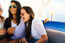 20-something Females Laugh Together On Ferris Wheel In Pacific Park In Santa Monica Pier, Santa Monica, California