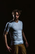 © Volodymyr - Handsome man in white tshirt with biceps and triceps