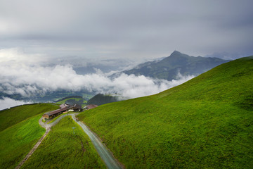 Sticker - Foggy landscape in the Alps mountains, Tirol, Austria. At the background is Kitzbuhel peak.