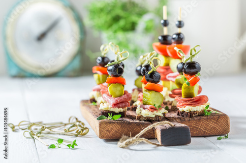 Cuadros en Lienzo Homemade various finger food with vegetables and herbs for party