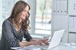 © aletia2011 - Portrait of a business woman with a laptop