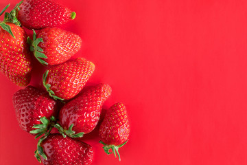 Strawberry on red background tasty postcard paper