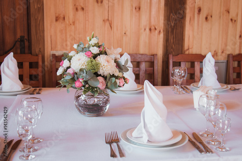 Stylishly Decorated Wedding Table With Flowers Candles Rose Petals