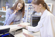 © gpointstudio - Close up of cash register in pharmacy