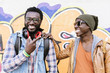 © santypan - Two black race friends having fun.