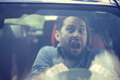 © pathdoc - Man driving a car shocked about to have traffic accident, windshield view
